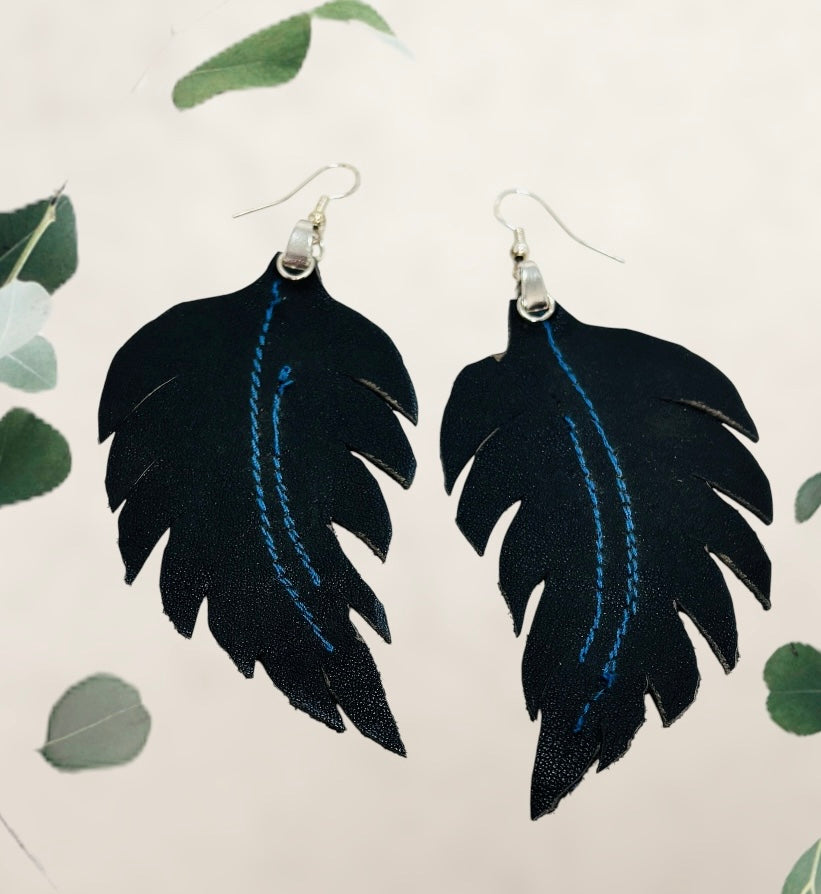 “DANCE IN THE WIND”~Soft Black Fleathers with Bright Blue Stitching and Silver Loops